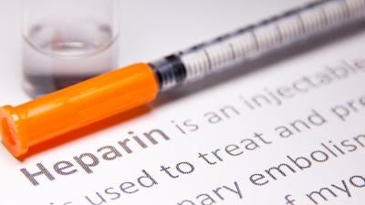 Picture of a needle with the word heparin underneath