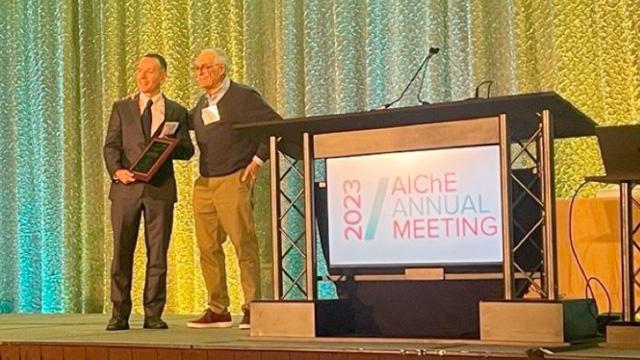 Photo of Dr. Koffas being presented the Fellowship Award